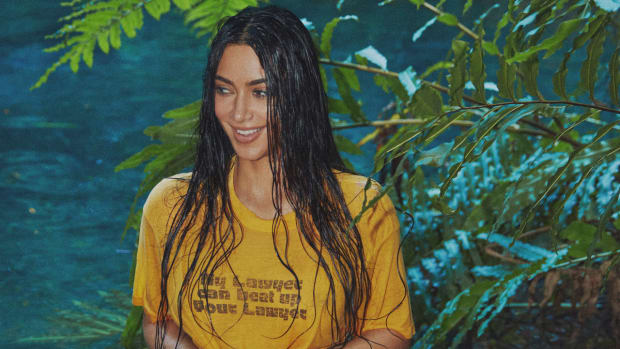 Kim Kardashian was photographed by Greg Swales in the Dominican Republic. Swimsuit by SKIMS. Top by Saint Luis vintage. 
