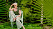 Maye Musk was photographed by Yu Tsai in Belize. Swimsuit by Maygel Coronel. Pants by Caroline Constas. Earrings by Cleopatra's Bling.