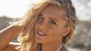 Camille Kostek was photographed by Derek Kettela in St. Croix. Swimsuit by Akoia Swim. Necklaces by Camille Collection by Dune Jewelry. 
