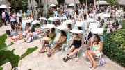 The crowd listening to SI Swimsuit panel discussions in Sunflow chairs at 2022 launch week.