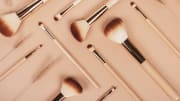 Set of natural wooden makeup brushes.