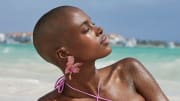 Madisin Rian was photographed by James Macari in the Dominican Republic. Earrings by Lele Sadoughi.