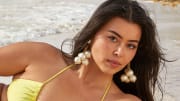Lauren Chan. Swimsuit by MESHKI. Earrings provided by New York Vintage.