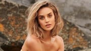Allie Ayers poses in a strapless bikini in front of the oceanfront rocks in Atlantic City.