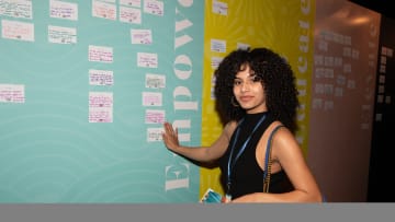 A TSN member stands next to her pledge at the event.