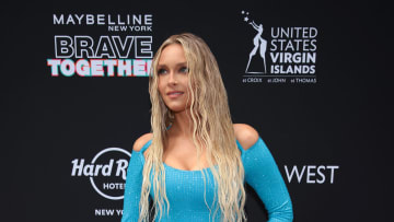 Camille Kostek on the SI Swimsuit 2022 red carpet wearing a dress she designed with Usama Ishtay.