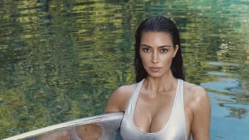 Kim Kardashian was photographed by Greg Swales in the Dominican Republic. Swimsuit by SKIMS. 