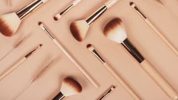 Set of natural wooden makeup brushes.