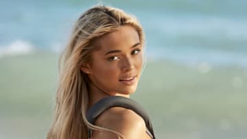 Olivia Dunne was photographed by Ben Watts in Puerto Rico. Swimsuit by Entire Studios.