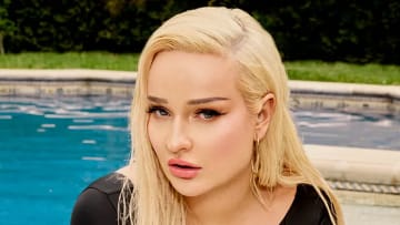 Kim Petras was photographed by Yu Tsai in Los Angeles. Swimsuit by LILY&ROSE. Earring by Jennifer Meyer.