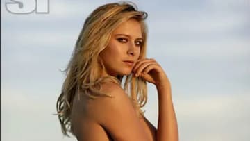 Maria Sharapova poses in a bikini and stares at the camera.