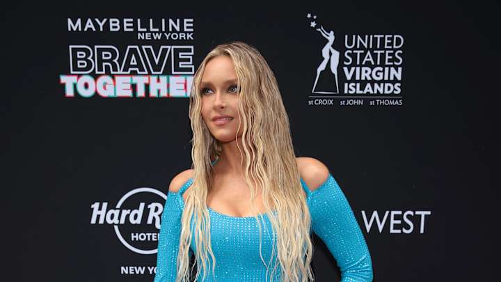 Camille Kostek on the SI Swimsuit 2022 red carpet wearing a dress she designed with Usama Ishtay.