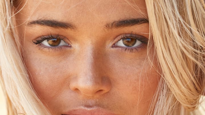 Olivia Dunne was photographed by Ben Watts in Puerto Rico. Swimsuit by Deep Blue Bikini Co.