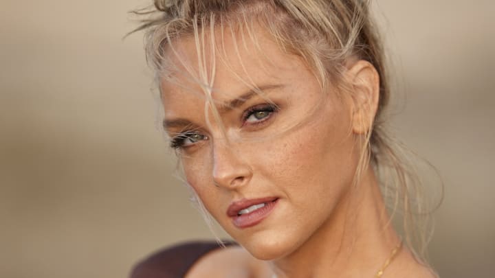 Camille Kostek was photographed by Derek Kettela in St. Croix. Swimsuit by Leimakani. Top by Calle del Mar. Necklaces by Child of Wild and Camille Collection by Dune Jewelry. 