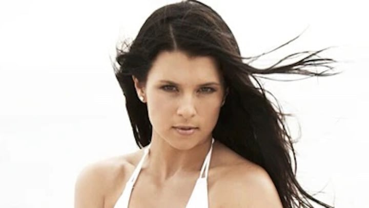 Danica Patrick poses in a white bikini. Danica Patrick poses in a white bikini.
