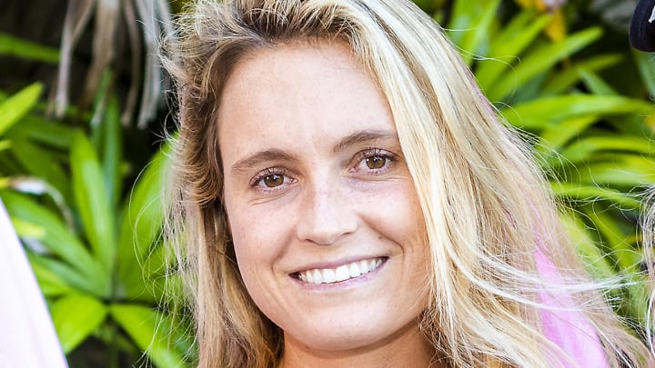 Alana Blanchard poses with her blonde hair down in a relaxed wave and smiles for the camera.