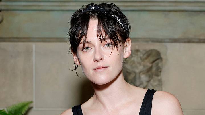 Kristen Stewart poses in a black tank and a tousled hairstyle. Kristen Stewart poses in a black tank and a tousled hairstyle.