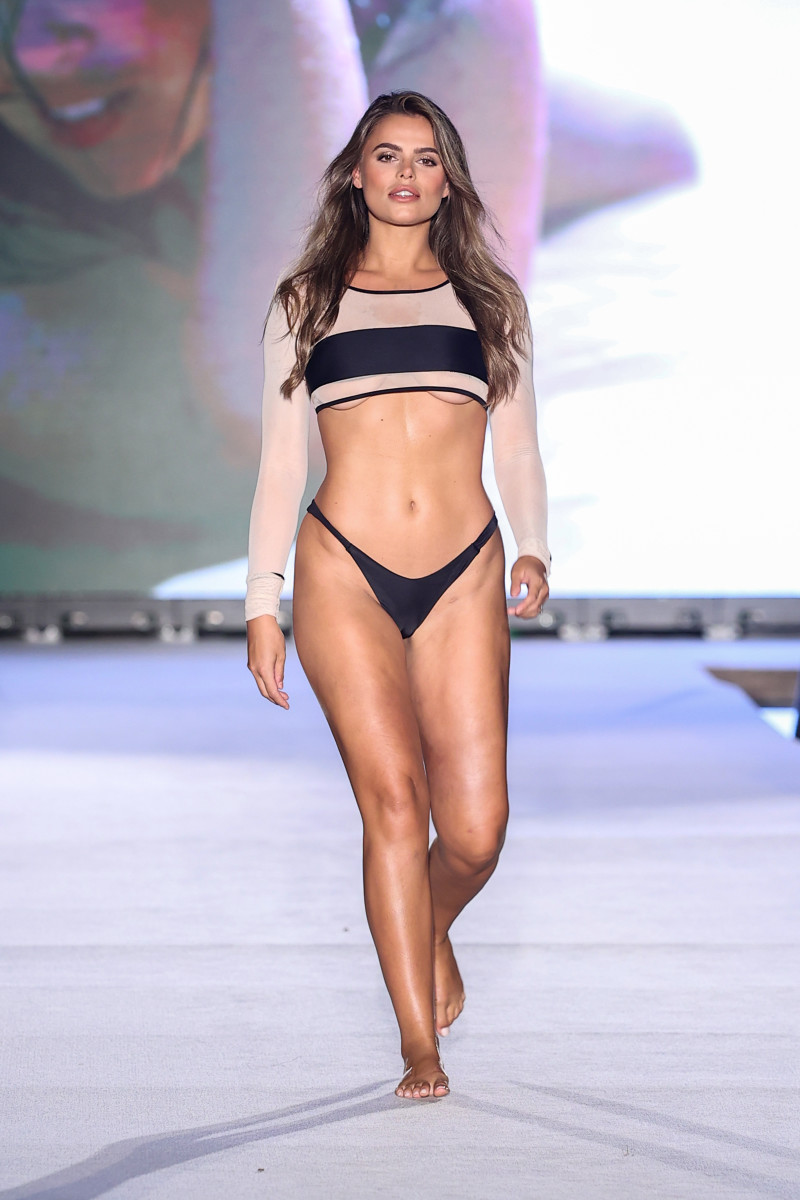 Brooks Nader walks the runway for Sports Illustrated Swimsuit Runway Show During Paraiso Miami Beach on July 16, 2022 in Miami Beach, Florida.