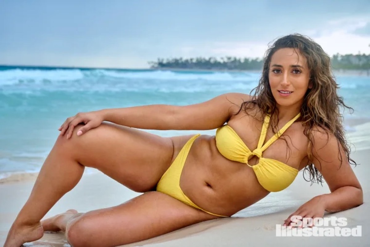 Sarafina El-Badry Nance poses on the sand in a yellow halter neck bikini.