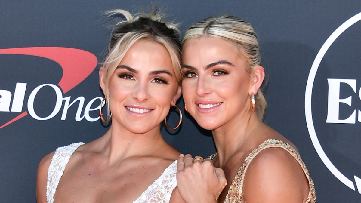 Hanna and Haley Cavinder smile for the camera in sparkly gowns and slicked-back up-dos.