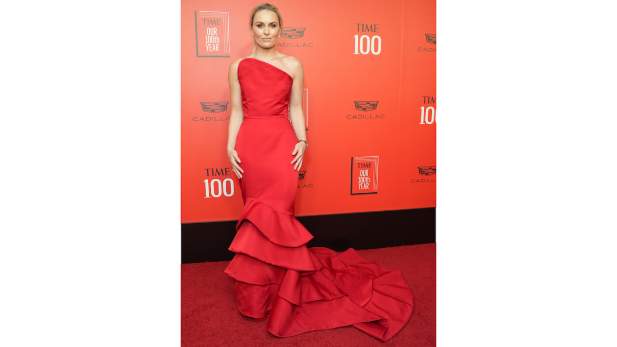 Lindsey Vonn poses on the red carpet in a strapless red gown.