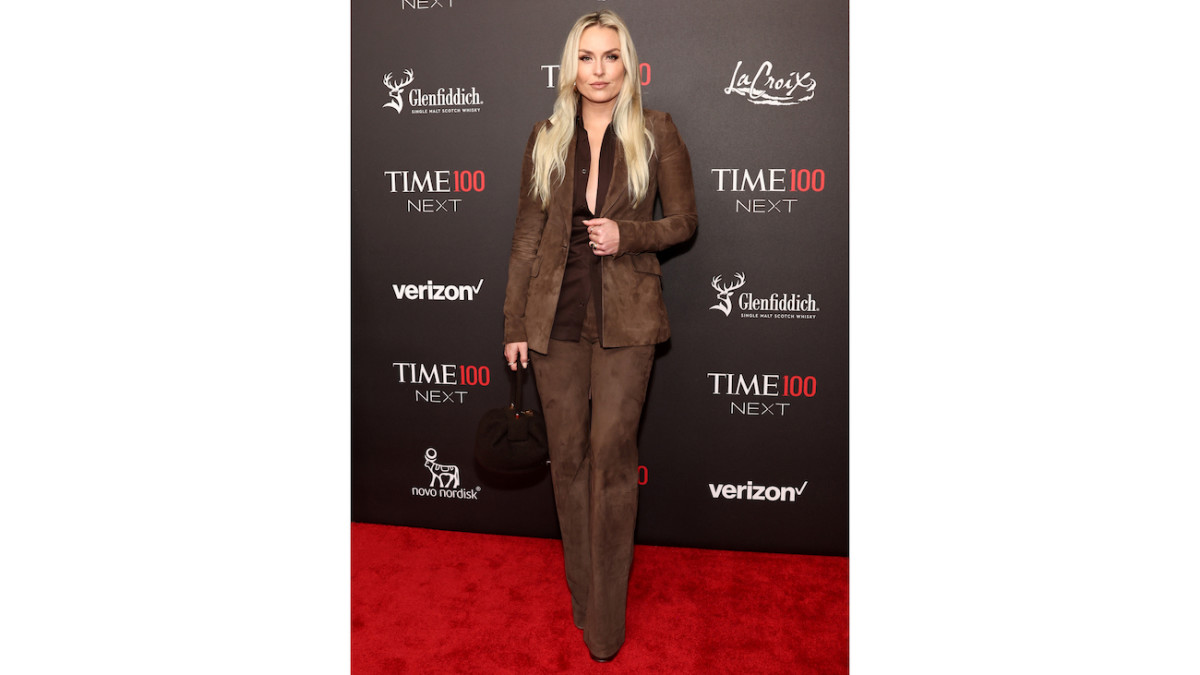 Lindsey Vonn poses in a chocolate brown suede suit.