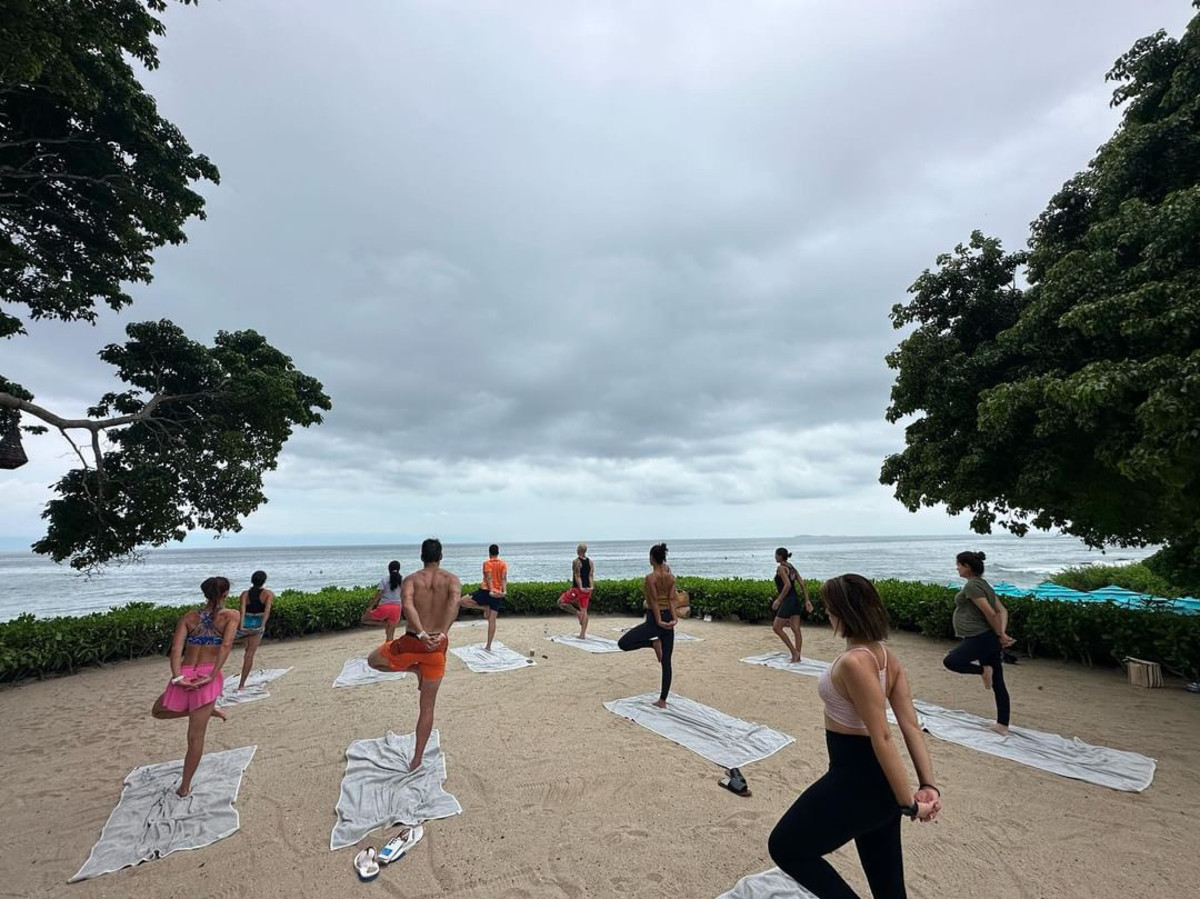 A morning beachfront yoga class at Bahia Mita surf and Spa Resort