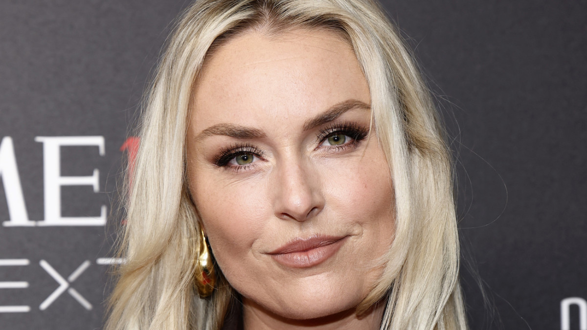 Lindsey Vonn sports her light blonde hair in a layered down-do and smiles softly for the camera.