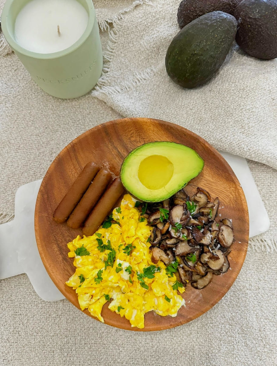 Scrambled eggs with mushrooms and avocados